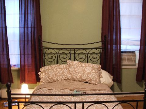 Straight-on bedroom shot.